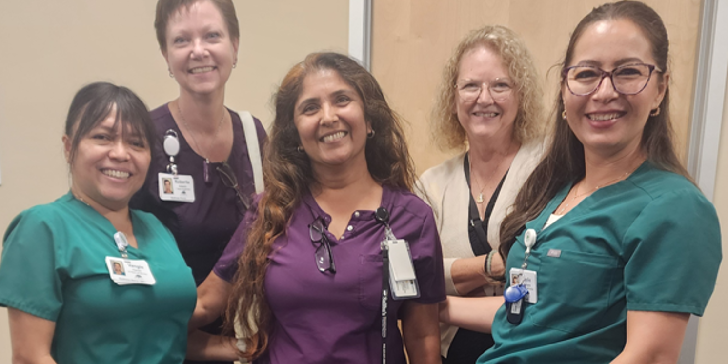 Royal Oaks employees taking a photo with Saliba's Pharmacy