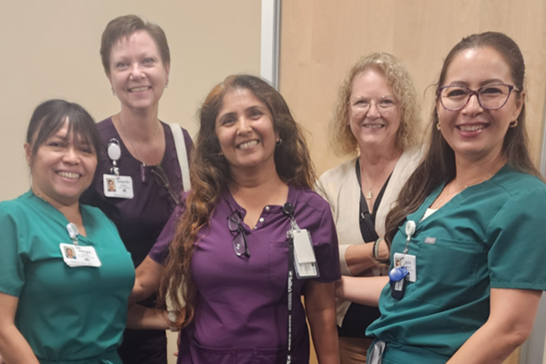 Royal Oaks employees taking a photo with Saliba's Pharmacy