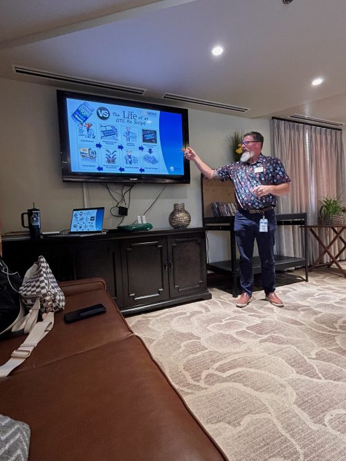 Man in front of presentation
