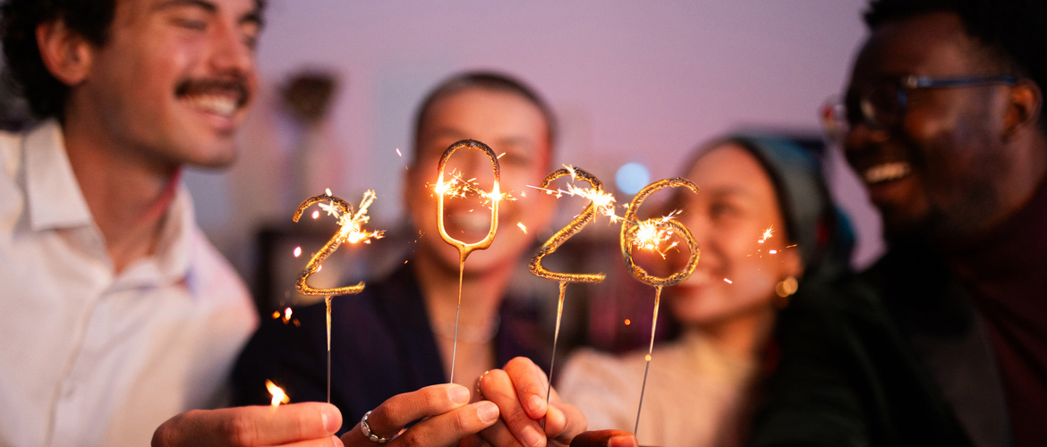 Group of friends celebrating the new year 2026 together with sparklers