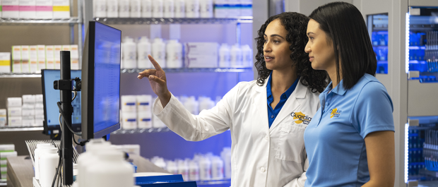 Pharmacist and tech 1170×700 Pharmacist and pharmacy technician reviewing medication orders for accuracy